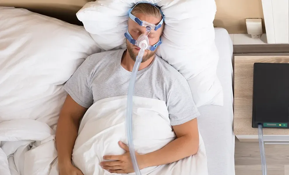 man with cpap mask