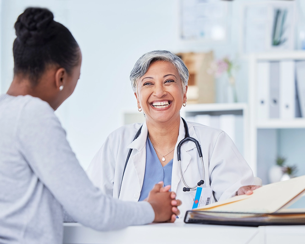 smiling nurse with patient